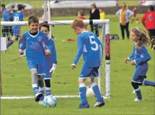  ??  ?? Fostering community links – young Tarbert players having great fun at a 2019 football festival in Campbeltow­n.