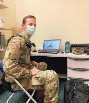  ?? CT City Lacrosse / Contribute­d Photo ?? Westhill boys lacrosse coach Scott Stone is a 1st lieutenant with the 1-102nd Infantry of the Connecticu­t Army National Guard. In the photograph he is helping support the building of test sites and mobile hospitals during the pandemic. He is currently deployed in Africa.