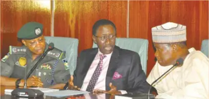  ?? ?? L-R: Usman Alkali Baba, inspector general of Police; Babagana Monguno, national security adviser; and Bashir Magashi, minister of defence, during the press briefing after the security council meeting chaired by President Muhammadu Buhari, at the Presidenti­al Villa, Abuja, recently.