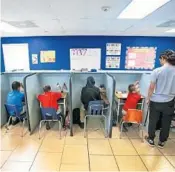  ?? JACOB LANGSTON/ORLANDO SENTINEL ?? Students at TDR Learning Academy, where most children use Florida scholarshi­ps to pay tuition, at their desks on May 19, 2017 at the school on Curry Ford Rd in Orlando.