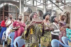  ?? AFP ?? Christian women of the Primitive Church of the Lord sing during the Sunday service to glorify God in Bukavu, eastern DR Congo, on March 20.