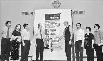  ??  ?? Groves (fourth right), Tiong (fourth left) and others at the launch of the Cambridge A-Level Programme at Woodlands.