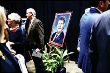  ?? ?? A portrait of Mississipp­i State head football coach Mike Leach stands at Humphrey Coliseum as a crowd gathers prior to the memorial service for the late coach on December 20. (Photo by Kevin Snyder, MSU Athletics, DTL file)