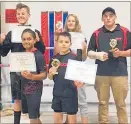  ?? Photo / Supplied ?? Nuki’s Taupo¯ Boxing Gym boxers with their titles after the North Island Golden Gloves: Back row left to right: Cole Campbell North Island 63kg open class cadet title holder, Paige Halliday North Island 57kg Junior female runner up, Jayden Ball North...