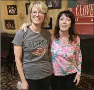  ?? JAMESON COOK — MEDIANEWS GROUP ?? Pictured are author Karen Dybis with Cloverleaf Bar and Restaurant owner Maria Guerra Easterby, daughter of Detroit-style inventor Gus Guerra, inside the restaurant last week after a talk by Dybis, author of “Detroit Style Pizza. A Doughtown History.”