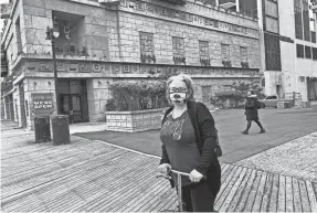  ?? MIKE KELLY/USA TODAY NETWORK ?? Lesley Kittler stops on the Atlantic City boardwalk while taking a break from gambling. During Kittler’s visit last week, she bid farewell to former Trump Plaza Casino, which was imploded Wednesday.