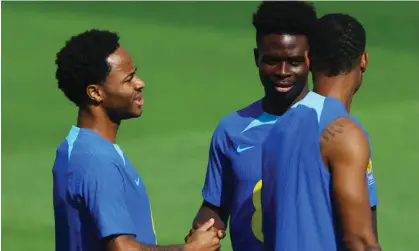  ?? Photograph: Hannah McKay/Reuters ?? England players Raheem Sterling and Bukayo Saka, now training with other players at the Al Wakrah stadium in Qatar, have been the target of racist abuse in the past.