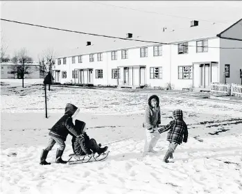  ??  ?? Shirley Card and her family have fun in the snow at the Little Mountain housing project in January 1971. Built in 1954 by the federal government, it was Vancouver’s first large-scale social housing project.
