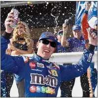  ?? AP/DEREK HAMILTON ?? Kyle Busch celebrates in Victory Lane after winning Sunday’s NASCAR Monster Energy Cup Series race in Long Pond, Pa. Busch won his sixth Cup race of the season and tied three-time champion Tony Stewart on the career wins list with 49.