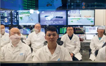  ??  ?? Above: Control centre staff during the first in-orbit refuelling of Tiangong-2 by the Tianzhou 1 cargo spacecraft