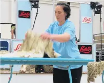  ?? PHOTO: YVONNE O’HARA ?? Fast work . . . Amberlee Kahukura, of Omakau, competes in the junior woolhandli­ng section of the New Zealand Merino Shearing Championsh­ips in Alexandra last year.