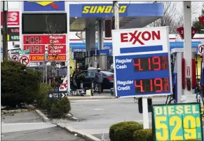  ?? SETH WENIG/ASSOCIATED PRESS ?? Gas prices are displayed at gas stations in Leonia, N.J., Monday, March 7, 2022. Gasoline prices are pushing even farther above $4a gallon, the highest price that American motorists have faced since July 2008, as calls grow to ban imports of Russian oil.