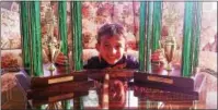  ?? SUBMITTED PHOTO ?? JJ Habres, 8, with his 2016 and 2017 World Pinewood Derby first-place trophies.