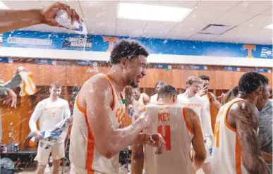  ?? TENNESSEE ATHLETICS PHOTO ?? Tennessee senior forward Olivier Nkamhoua finds himself in the middle of some celebrator­y spray after his 27-point performanc­e in Saturday afternoon's 65-52 NCAA tournament win over Duke in Orlando, Fla.