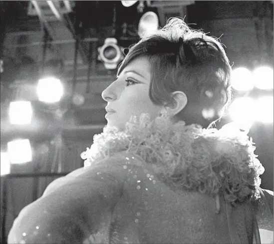  ?? CBS Photo Archive ?? AN OFF-CAMERA MOMENT captures Barbra Streisand during the taping of her 1966 TV special “Color Me Barbra,” a follow-up to 1965’s “My Name Is Barbra.”