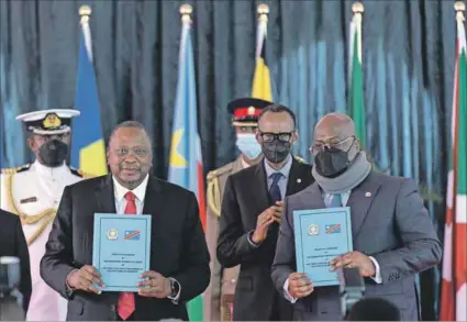  ?? Photo: Tony Karumbu/afp ?? Significan­t opportunit­y: Kenya’s Uhuru Kenyatta (left) and the DRC’S Felix Tshisekedi (right) with Rwanda’s Paul Kagame (centre) at the ceremony admitting the DRC to the East African Community.