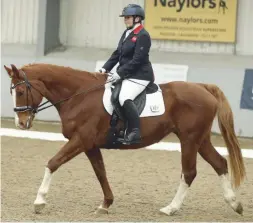  ??  ?? Julie Payne scoops the grade I gold riding her own mare, Pandora