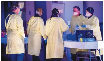  ?? ADOLPHE PIERRE-LOUIS/JOURNAL ?? Presbyteri­an Healthcare Services personnel work at a COVID-19 testing site on San Mateo NE in February. The state’s largest private employer now requires COVID-19 vaccinatio­ns for all its employees.