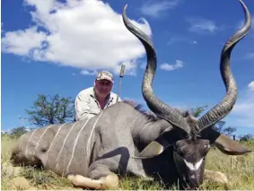  ??  ?? Trophy: Mr Sailor with a kudu, a type of antelope, on a hunting trip