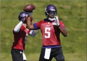  ?? JIM MONE — THE ASSOCIATED PRESS FILE ?? In this file photo, Minnesota Vikings quarterbac­k Teddy Bridgewate­r throws a pass during the practice in Eden Prairie, Minn. One year ago, Teddy Bridgewate­r went down during a routine practice drill with a devastatin­g injury to his left knee....