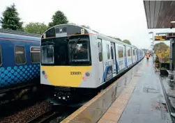  ?? PAUL BICKERDYKE ?? Left: No. 23001 at Barrhead on October 29 having run on battery power from Glasgow Central.
Below left:
The modern, bright and airy interior of
No. 230001.
Below right: The cab of No. 230001, far removed from its days as a London Undergroun­d ‘D78’.