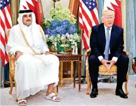  ??  ?? US President Donald Trump, right, with Qatar’s Emir Sheikh Tamim Bin Hamad Al-thani