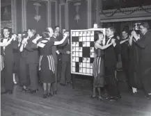  ??  ?? 0 Couples do the ‘Crossword Puzzle’ at East Ham Palais de Dance in 1925 - the first book was published today in 1924.