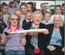  ??  ?? All ages admire the Queen’s Baton at Bowmore