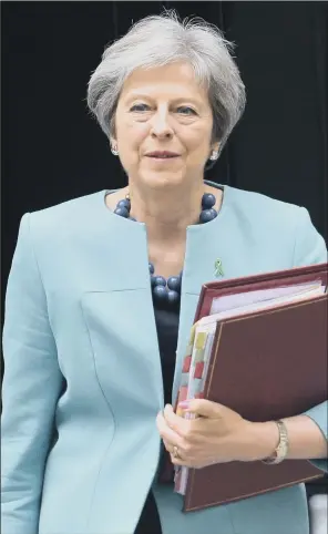  ??  ?? Prime Minister Theresa May’s Brexit trade strategy faced new headwinds today as Harvard academics cast doubt on a free trade deal with the US and splits within her Cabinet remain.