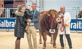  ??  ?? Limousin champion bull Anside Orton, with Martin Irvine, right, and judge Andrew Gammie, left, with his wife Kathryn and son Finlay.