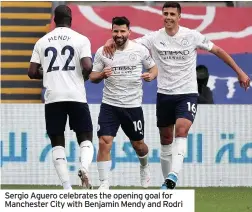  ??  ?? Sergio Aguero celebrates the opening goal for Manchester City with Benjamin Mendy and Rodri