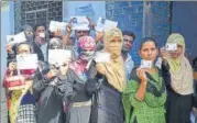  ?? ANI ?? ▪ Voters stand in queue at a polling station in Prayagraj on Sunday.