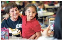  ?? Godofredo A. Vasquez / Houston Chronicle ?? A grand day at school
Rebeca Montenegro takes a picture with her granddaugh­ter Daniela Rodriguez, 6, after sharing lunch at Shearn Elementary School during Grandparen­ts’ Day on Thursday.