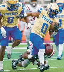 ?? ?? Phoebus running back Davion Roberts runs for 16 yards to set up a touchdown during the Class 4 state championsh­ip game.