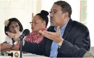  ?? PHOTO BY CARL GILCHRIST ?? Shadow Tourism Minister Wykeham McNeill responds to concerns expressed by craft traders. From left are Mildred McCalla of Ocho Rios and Evadney Brown McCalla of Falmouth.