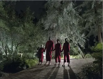  ?? ASSOCIATED PRESS ?? This image released by Universal Pictures shows Evan Alex, from left, Winston Duke, Shahadi Wright Joseph and Lupita Nyong’o in a scene from “Us,” written, produced and directed by Jordan Peele.