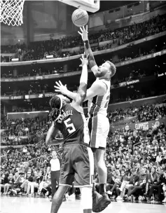  ?? - AFP photo ?? Blake Griffin #23 of the Detroit Pistons shoots the ball against the LA Clippers on January 12, 2019 at STAPLES Center in Los Angeles, California.