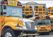  ?? THE ASSOCIATED PRESS ?? Rows of school buses are parked at their terminal in Zelienople, Pa. Pennsylvan­ia schools are working on how they will safely transport students this fall, but one idea that won’t be part of the plan is to install plastic barriers around school bus drivers. The state Transporta­tion Department rejected that idea recently, saying there wasn’t evidence it’ll make anyone safer.