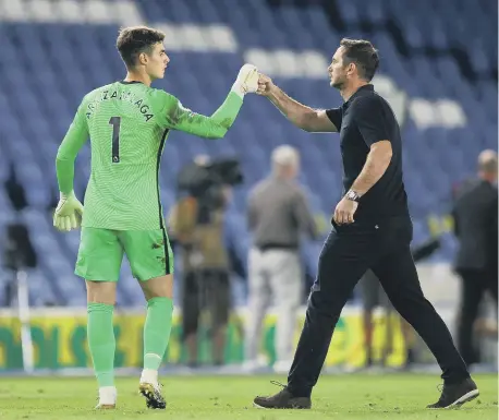  ??  ?? Chelsea goalkeeper Kepa Arrizabala­ga greets manager Frank Lampard.