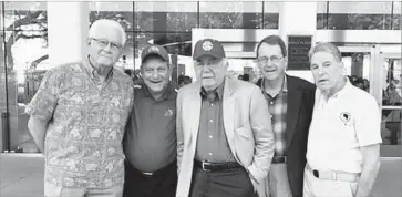  ?? Maria Aparicio ?? UCLA’S CARD SHOW at the 1957 game featured some pro-USC slogans, thanks to a group of USC students that included, from left, Dave Visel, Mike Loshin, Walter Karabian, Jerry Van Wert and Steve Marienhoff.