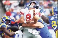  ?? Rich Schultz / Getty Images ?? The Rams’ Leonard Floyd strip sacks the Giants’ Daniel Jones in the first quarter on Sunday at MetLife Stadium in East Rutherford, N.J.