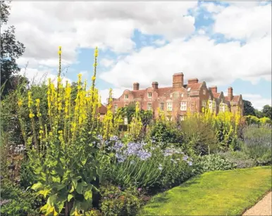  ??  ?? Visitors to Godinton House are being asked to choose their favourite variety of the garden’s collection of cosmos flowers as part of a trial conducted by the Royal Horticultu­ral Society