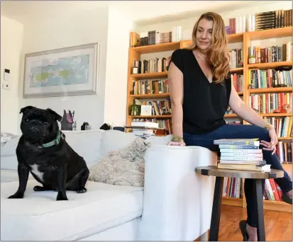  ?? PHOTO BY AXEL KOESTER ?? Grief therapist and author Claire Bidwell Smith, pictured here with her dog Walter, works from home in Santa Monica.