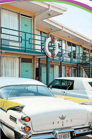  ?? NATIONAL CIVIL RIGHTS MUSEUM ?? Vintage cars sit parked beneath the motel balcony where King was standing when he was assassinat­ed five decades ago, in 1968. The National Civil Rights Museum surrounds the old motel.