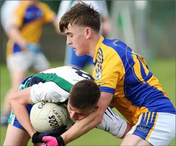  ??  ?? Darren Hayden of Taghmon-Camross tackles John Paul Hurley (Arklow Geraldines-Ballymoney).