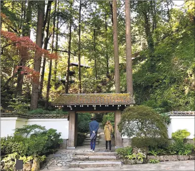  ?? PHOTOS BY JACKIE BURRELL — BAY AREA NEWS GROUP ?? Winding paths, stately trees and entrance gates add to the drama at Oregon’s Portland Japanese Garden.