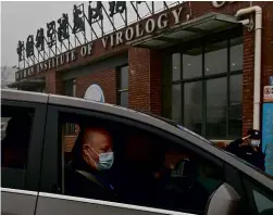  ??  ?? ABOVE: Peter Daszak arrives at the Wuhan lab as part of the WHO team – but he is also president of a US organisati­on that funded coronaviru­s research at the WIV.