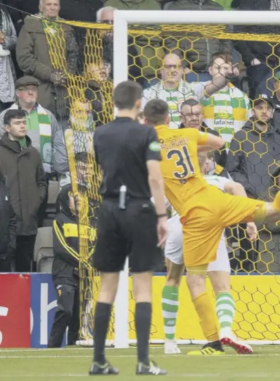  ??  ?? 0 Declan Gallagher’s header is tipped away by Celtic keeper Scott Bain, while, below left, Livingston striker Dolly Menga squares up to Ryan Christie.