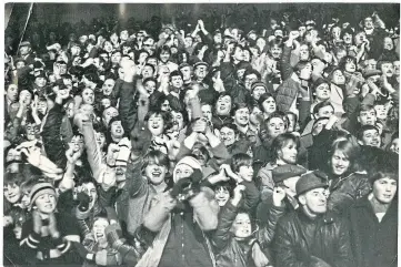  ?? ?? Jubilant Dundee United supporters celebrate the opening goal against Winterslag.