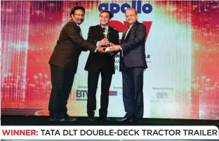  ??  ?? WINNER: TATA DLT DOUBLE-DECK TRACTOR TRAILER (L to R) Vijay Kumar, Head – Engineerin­g & Operations, Tata DLT, Rajeev Batra, Chief Operating Officer, Tata DLT, and Vinod Aggarwal, Managing Director & Chief Executive Officer, VE Commercial Vehicles.